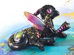 Black and gold armored fairy dragon