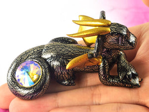 Black and champagne foil scaled dragon