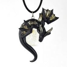 Load image into Gallery viewer, Black and silver wyvern necklace with silver dichroic glass focal