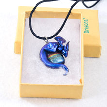 Load image into Gallery viewer, Blue wyvern necklace with dark rainbow dichroic glass focal