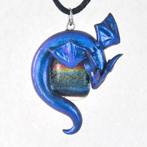 Blue wyvern necklace with dark rainbow dichroic glass focal