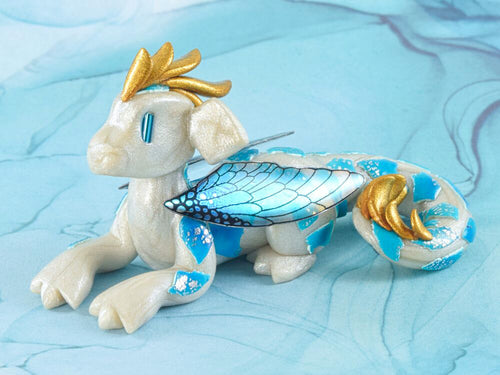 White and blue scrappy fairy dragon